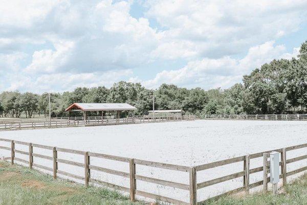 Two outdoor arenas and covered gazebo for watching.