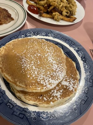 Pancakes - blueberries on the bottom and who asked for powdered sugar...