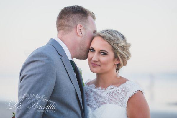 Groom kissing his bride - Liz Scavilla Photography