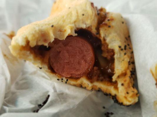 Inside the chili and onion dog.