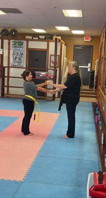 Earning yellow black stipe belt