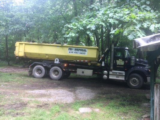 Pro Disposal truck backing up again next to house