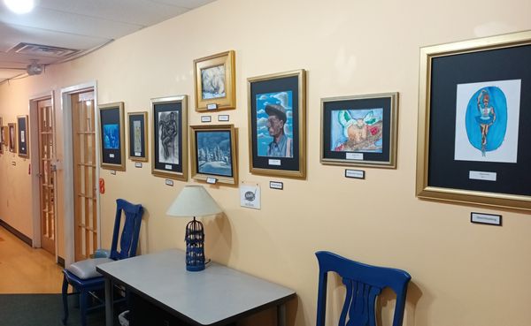 ActonArt lobby filled with student artwork. ActonArt offers Drawing, Painting, and Manga Classes for kids, teens and adults.