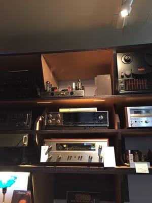 An old kit tube amp and various other vintage equipment.