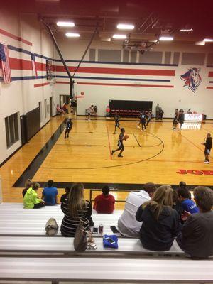 Boys playing basketball in the nice gym