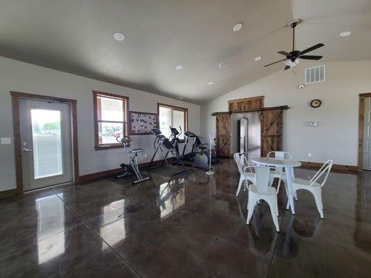 Gym equipment in corner of social room