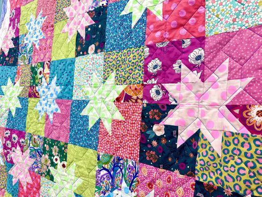 A colorful quilt featuring scrappy fabrics!