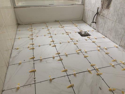 Tiles been install along with vanity and toilet