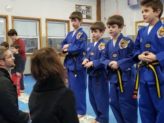 children wish their elders (grandparents, aunts and uncles, parents) a happy new year by performing a deep traditional bow