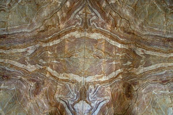 Bookmatched slabs used as granite flooring in a foyer.  See our website for more information www.sfistone.com