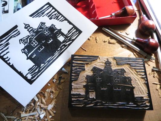 Linoleum cut of the Wickfield Sales Pavilion near Cantril, Iowa.