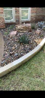 Arizona theme front landscape, with water feature bubbling rock.