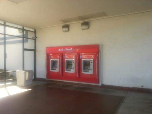 ATMs on the opposite side of the building from the entrance