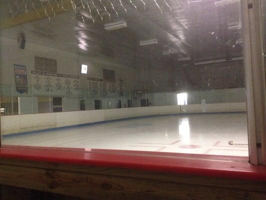 The building is mostly rink, with a narrow path to a few locker rooms, and a decent wall of wooden bleachers.