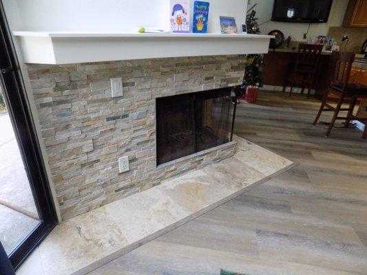 Fireplace, mantle, hearth, flooring were all completed by Custom Tile