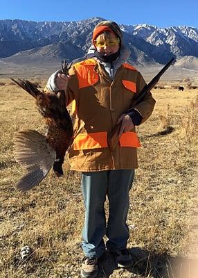 Max and a hefty rooster at Lone Pine Pheasant Club.