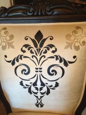 Custom stenciled fabric on furniture.