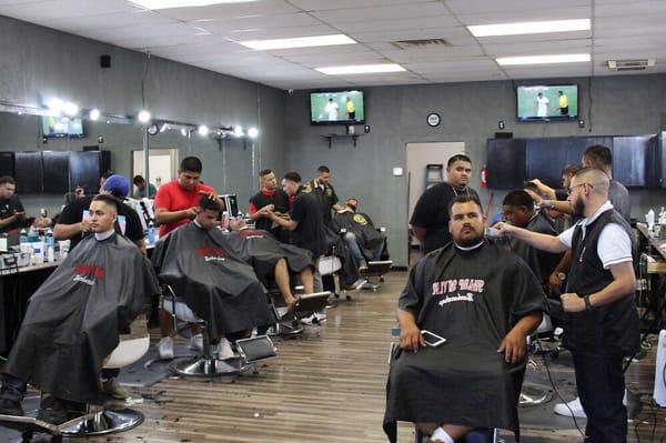 The team in action! Stop by for your fresh haircut, remember to STAY SHARP!