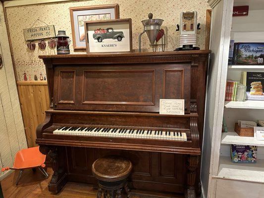 Cute piano with a snarky sign for wanna be piano players