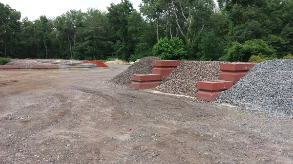 Interlocking retaining wall blocks 2'x'2'x4' weight 2400lbs each. Use them to build bins to separate your materials.