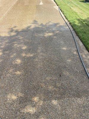 In process of surface washing driveway.