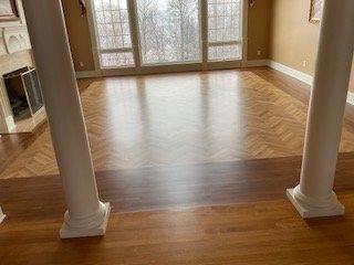 Great room hardwood herring bone floor.