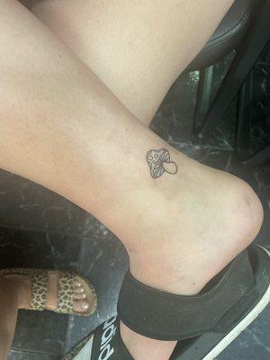 Small mushroom tattoo