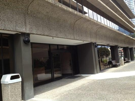 Entrance. Once you enter building, office is the first door on the right (after the restroom).