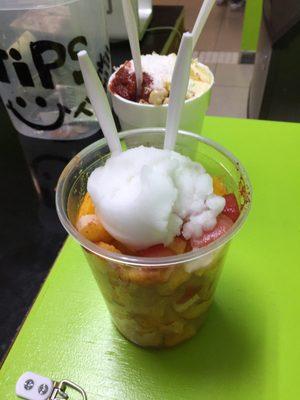 A large fruit cup w lime shaved ice and a large elito Mexicano (corn in a cup Mex style)