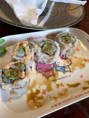 Spicy salmon roll. Comes warm with half cooked salmon. Had to add wasabi and soy sauce as no dipping bowl was provided for sushi.