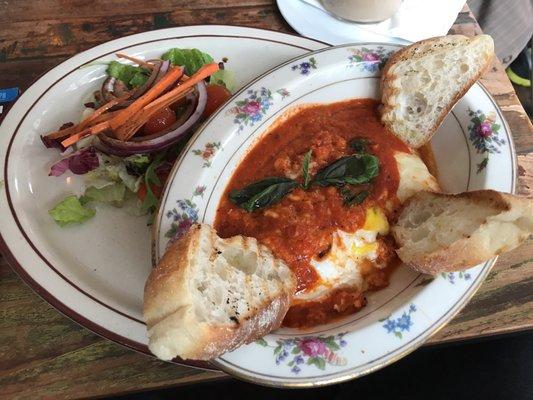 Baked eggs in spicy tomato sauce.