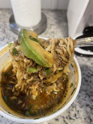 Ramen noodles, shredded beef, cilantro and avocado.