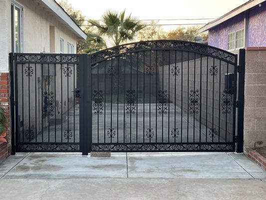 Custom drive way gate with pedestrian walk in gate and electric motor