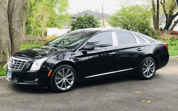 Cadillac XTS for up to 4 passengers with minimal luggage.