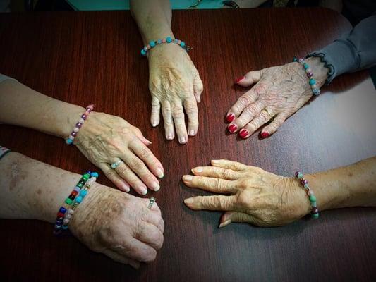 Residents showing off their friendship bracelets.