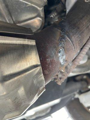 Exhaust pipe repaired with a line weld