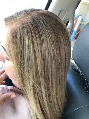 Hair color blended with natural hair color and straightened.