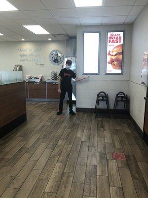 A nice dining room/front register employee showing me the new breakfast baconator!