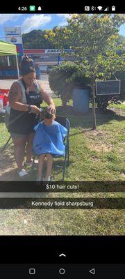 Fundraiser doing haircuts