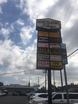 Sign with posted businesses on the N/E Corner of Oxnard & Whitsett