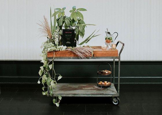 Drink or dessert cart, welcome table. Part of the industrial and reclaimed wood rentals available at Vintage Meets Modern