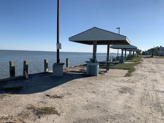 Along the sea wall. In front of roll A.