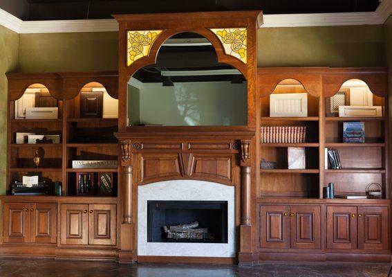 Classic library with TV hidden by interrogation glass mirror.