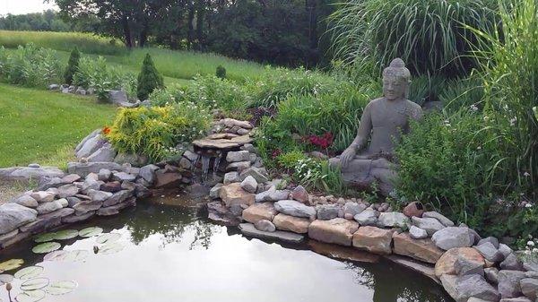 Our students enjoy practicing Qigong and meditation next to our Buddha Pond