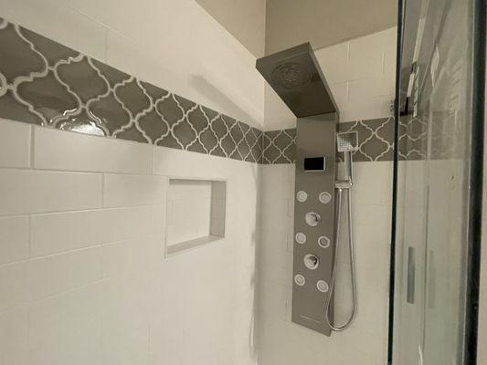 Upgraded shower head/wall.