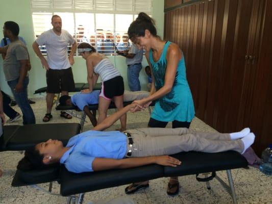 Dr. Fallahi working with Dominican high school kids.