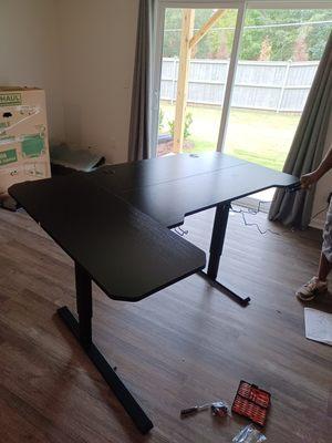 Stand up desk that goes up and down, assembled for customer on day of there move