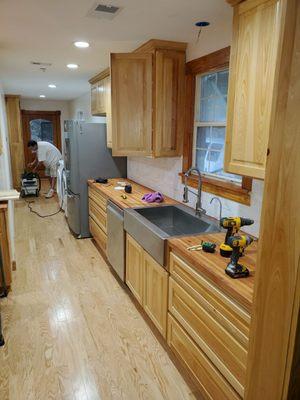 Cypress Custom Cabinets with butcherblock countertop