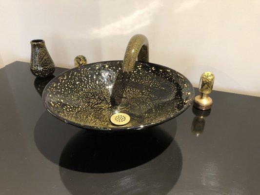 Gold and black glass faucet