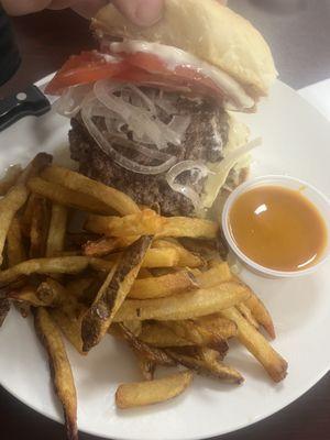 Cheeseburger and fresh cut fries with honey mustard sauce.